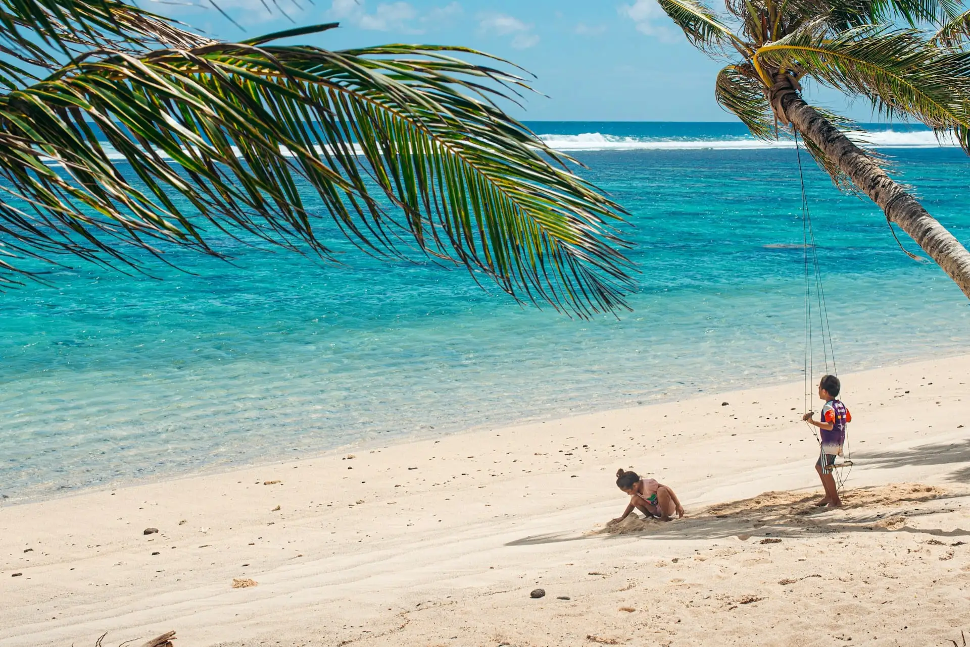 Children playing on a sandy beach in Zanzibar