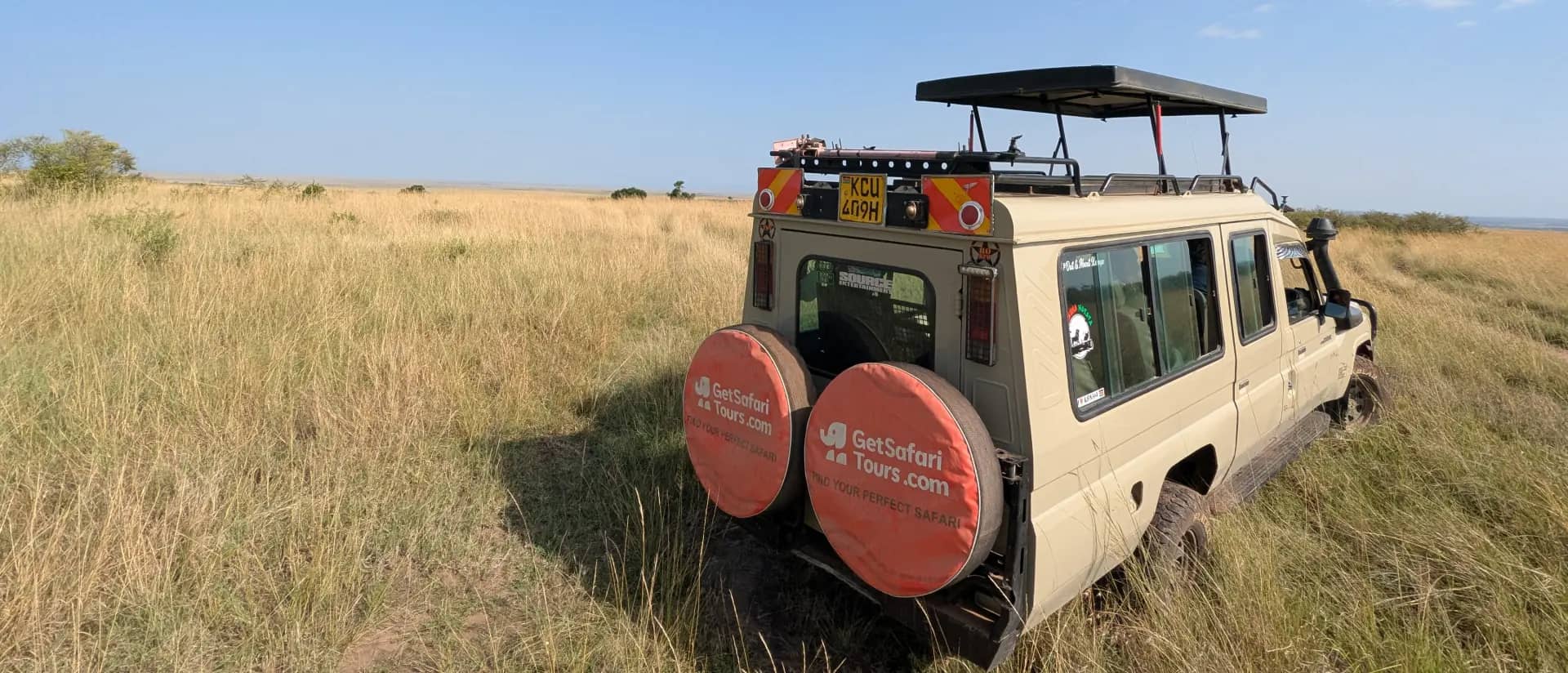 GetSafariTours branded safari vehicle on the savanna plains