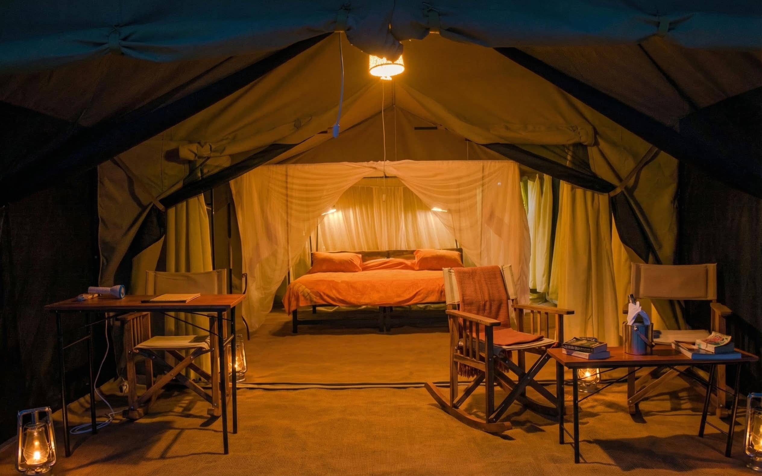 Tented lodge interior with real beds